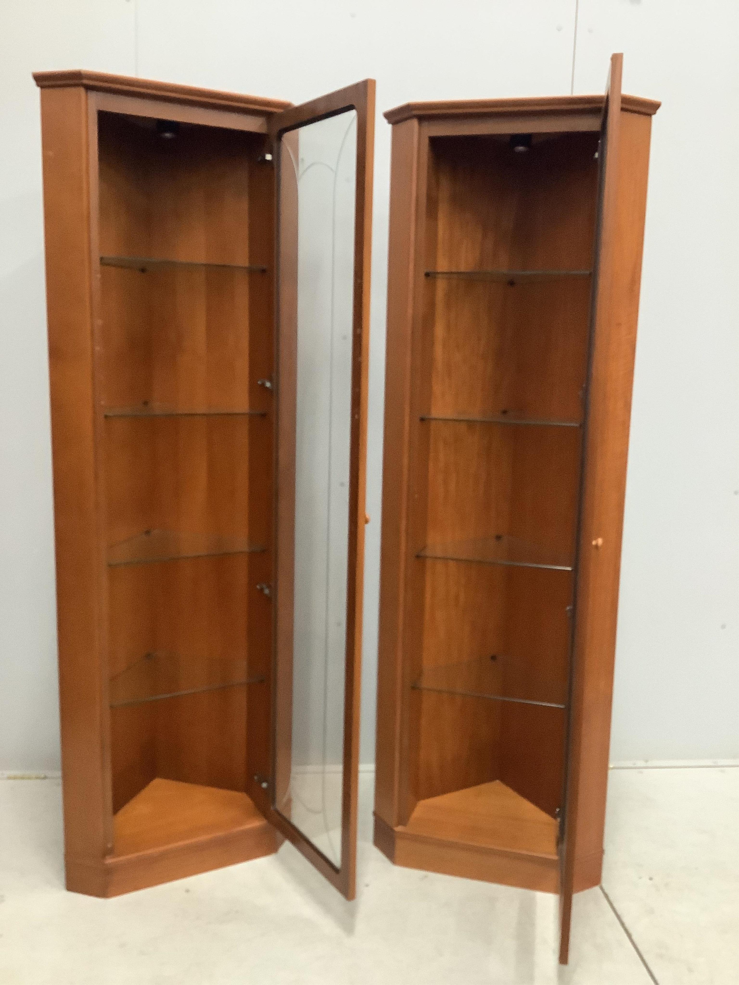 A pair of mid century G Plan teak corner cabinets, width 61cm, depth 39cm, height 185cm. Condition - good